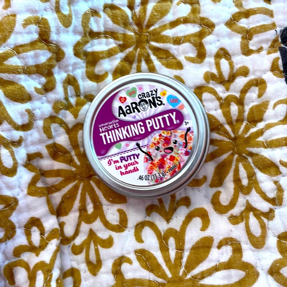 Clear thinking putty with hearts in it with cute little messages on them.